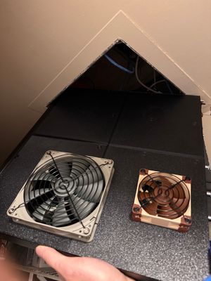 Measure twice, buy and modify a switch once. A photo of a hand holding a large networking switch diagonally against the opening of a ceiling access panel, demonstrating that the switch does not fit through the opening. Not pictured: a very disappointed man feeling foolish.